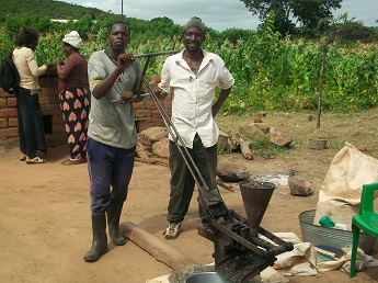Men with oil press